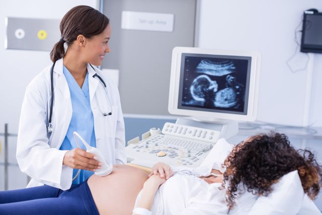 Doctor Performing Ultrasound Scan for Pregnant Woman in Hospital - Download Free Stock Photos Pikwizard.com