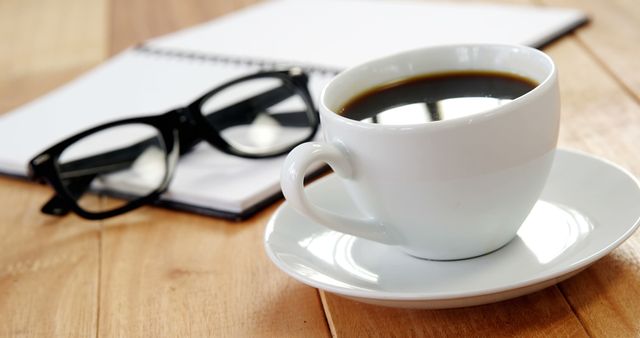 Coffee Cup, Notebook, and Glasses on Wooden Desk - Download Free Stock Images Pikwizard.com