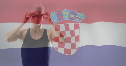 image captures determined female swimmer adjusting goggles with background blend of croatian national flag, evoking themes great for promoting international sports events, highlighting commitment in athletics, underscoring themes teamwork, preparation, national pride.