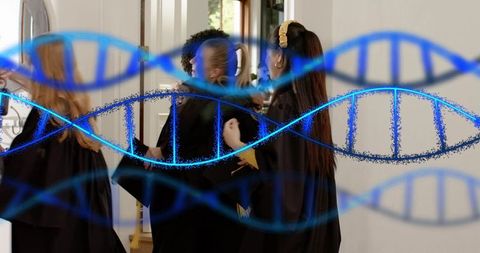 Graduates celebrating and adjusting robes in lobby with blue dna double helix overlay