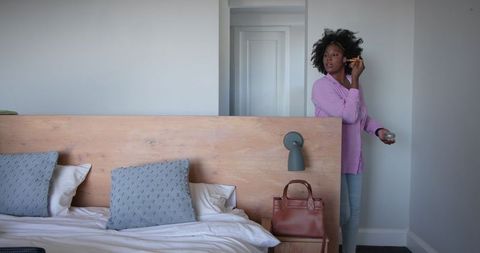 Woman Getting Ready in Bedroom with Modern Décor