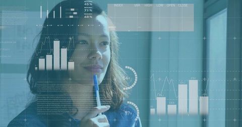 Businesswoman Analyzes Data Visualizations in Office