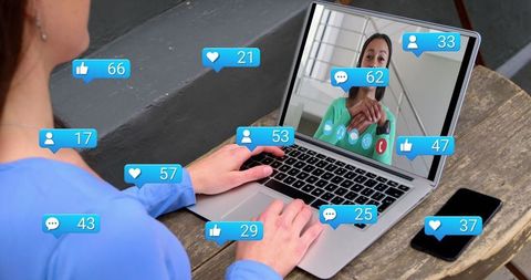 Woman Engaging in Social Media Interaction on Laptop