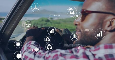 Driving with hud telematics overlays showing eco analytics, dashboard metrics, coastal road