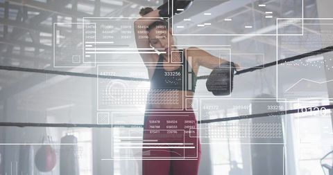 Female boxer leaning on ropes with hud fitness-data overlays for performance training