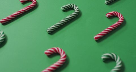 Candy Canes Arranged on Festive Green Background