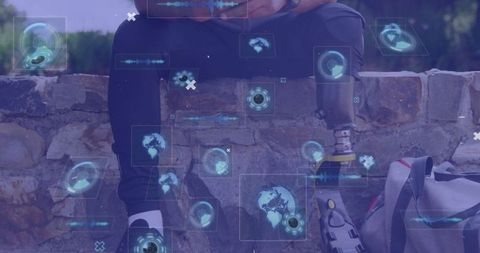 Cyber Innovation: African American Man with Prosthetic Limbs and Smartphones