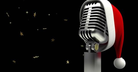 Retro microphone with santa hat on black background