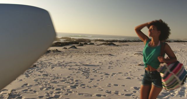 Woman Enjoying a Sunny Beach Day in Summer - Download Free Stock Images Pikwizard.com