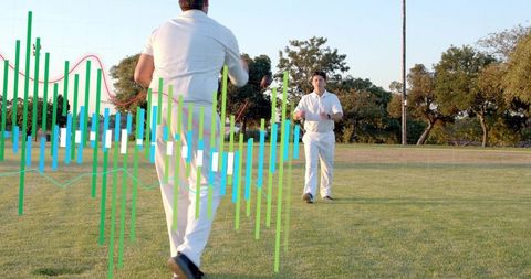 Cricket players running on grassy field with performance analytics overlay