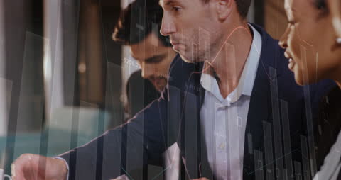 Business Colleagues Analyzing Data with Digital Interface Overlay