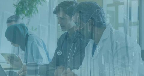 Medical team reviewing patient data with digital charts and collaboration in hospital