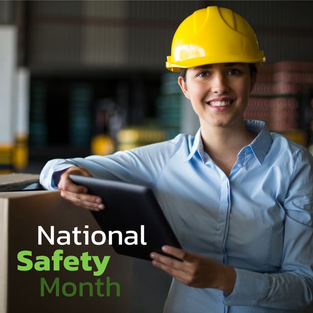 Smiling Worker in Hard Hat Holding Tablet during National Safety Month - Download Free Stock Templates Pikwizard.com