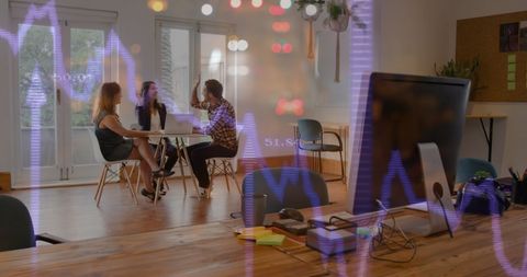 Business Meeting Overlaid with Digital Financial Graphs