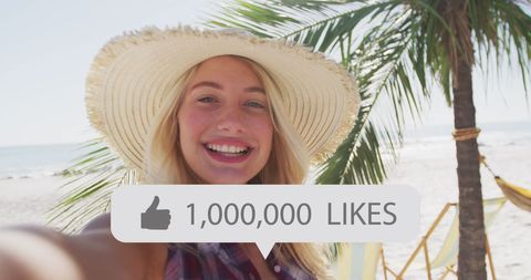 Happy Woman Celebrating Online Success on Beach