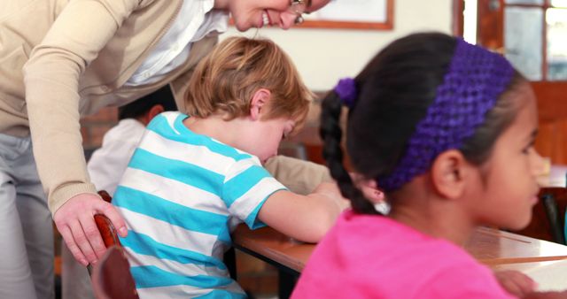 Teacher Helping Students In Classroom - Download Free Stock Images Pikwizard.com