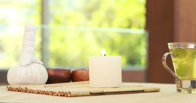 Tranquil Spa Setting with Burning Candle and Herbal Tea - Download Free Stock Images Pikwizard.com