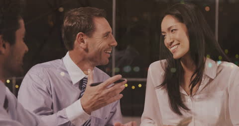 Diverse Business Team Collaboration in Evening Office