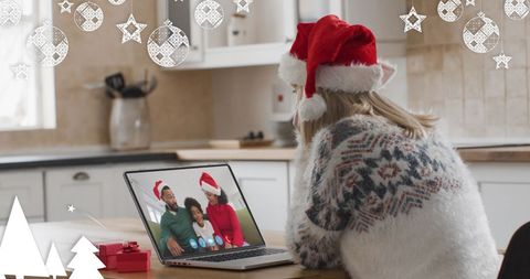 Woman Video Conferencing with Family During Christmas Celebration