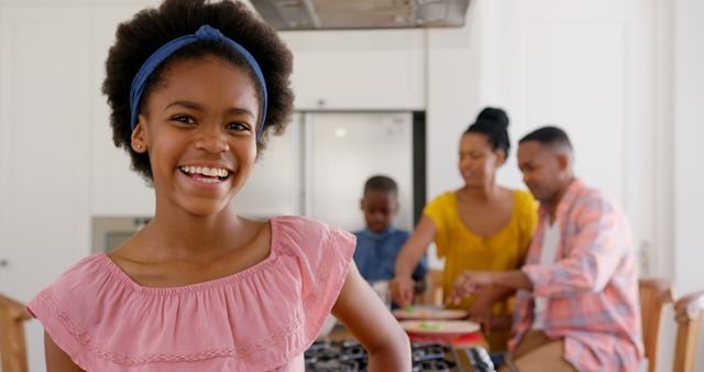 Front view of happy black girl looking at camera in a comfortable home - Download Free Stock Photos Pikwizard.com