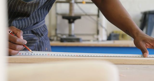 Close-Up of Carpenter Measuring Wood with Precision - Download Free Stock Images Pikwizard.com