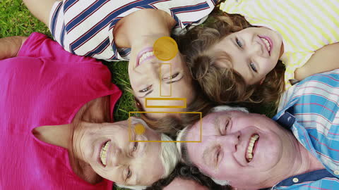 Caucasian Family Lying on Grass Smiling Joyfully