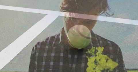 Artistic Double Exposure of Man with Tennis Ball and Flower
