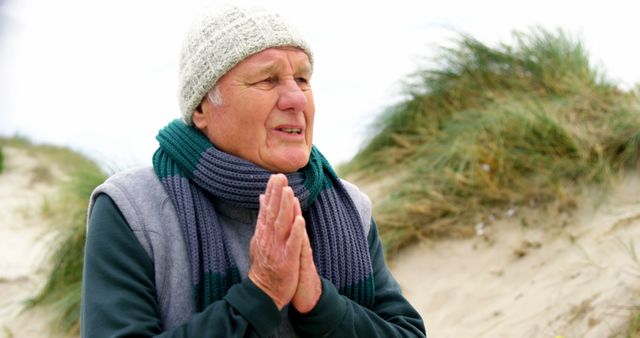 Senior Man Bundled Up on a Windy Outdoor Walk - Download Free Stock Images Pikwizard.com