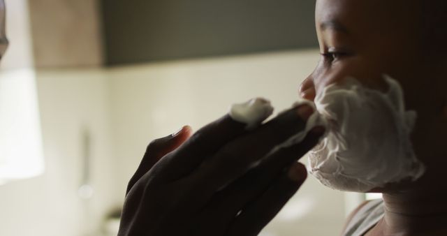 Father Putting Shaving Cream on Son's Face in Bathroom - Download Free Stock Images Pikwizard.com