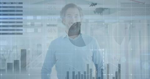 Standing mature businessman in modern office with digital analytics overlay and charts
