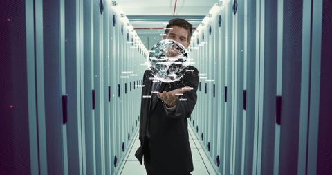 Businessman Holding Digital Globe in Data Center