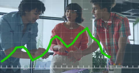 Colleagues Analyzing Financial Graphs in Office Environment