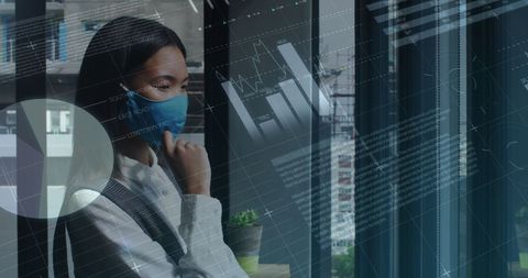 Asian businesswoman analyzing financial data during pandemic