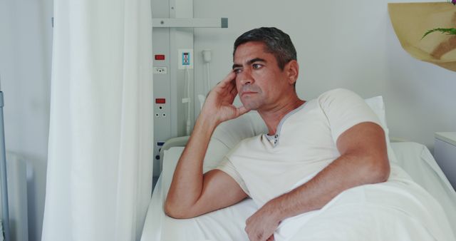 Pensive Man Resting In Hospital Bed - Download Free Stock Images Pikwizard.com