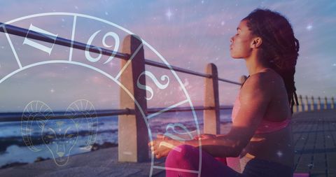 Woman Meditating at the Beach with Astrology Elements