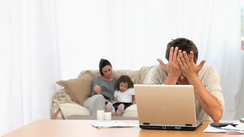 Stressed Man Facing Screen Problems at Home