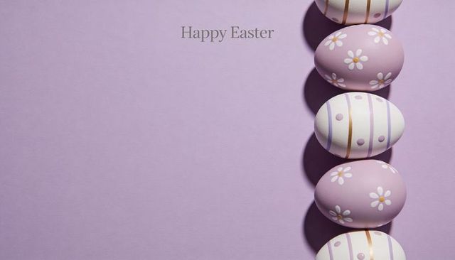 Pastel easter eggs aligned right on lavender backdrop featuring happy easter text and copy space