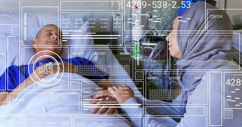 Caregiver in grey hijab holding senior male patient on hospital bed with telemetry hud overlay