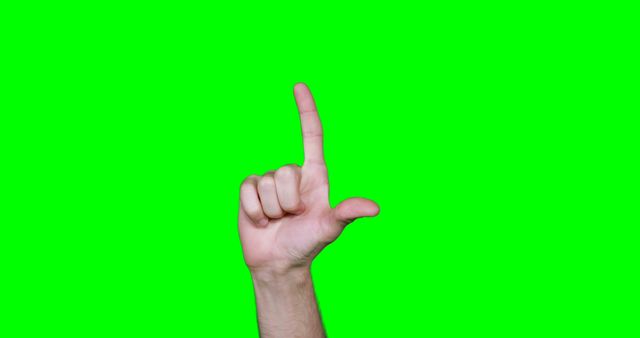 Hand making symbol against green screen