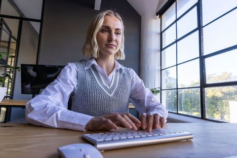 Businesswoman focused on work at modern office desk
