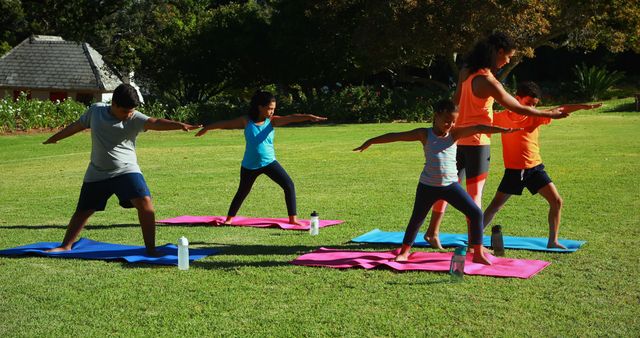 Outdoor Family Yoga Session on Sunny Day - Download Free Stock Images Pikwizard.com