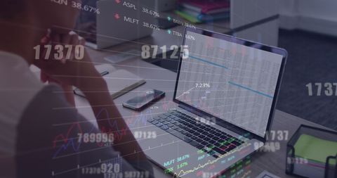 Biracial Woman Analyzing Stock Market Data on Laptop
