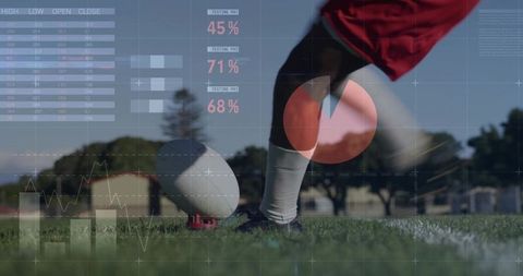 Teen kicking rugby ball with live performance analytics overlay on grass turf
