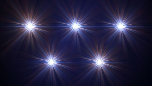 Radiant white light beams against dark cosmic backdrop