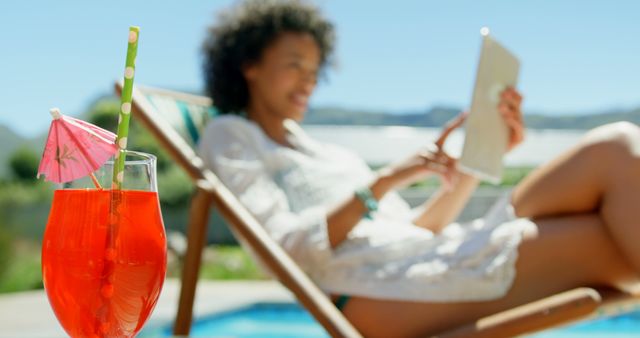 Woman lounging by a pool, holding a digital tablet and enjoying a tropical drink, ideal for vacation and summer themes. Perfect for illustrating relaxation, leisure, and modern lifestyle. Can be used for travel brochures, lifestyle blogs, and wellness concepts.