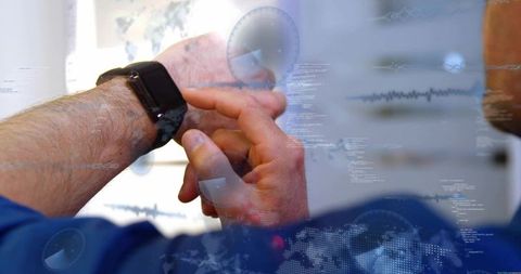 Mature professional tapping smartwatch with holographic data overlays in modern workspace