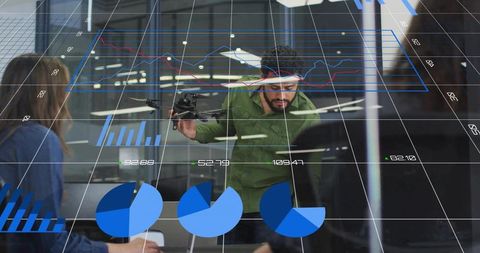 Engineering team analyzing drone with augmented data visualizations for design review