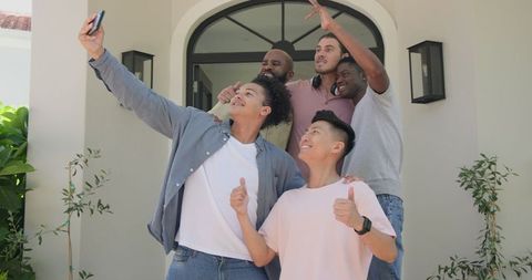 Friends Enjoying Reunion at Home Entrance, Celebrating Joyful Gathering