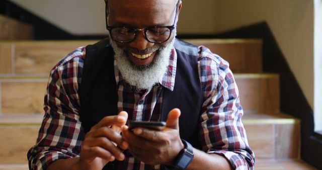 Stylish Older Man Smiling While Using Smartphone - Download Free Stock Images Pikwizard.com