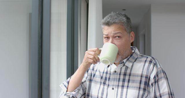 Senior Man Enjoying Morning Coffee by Window in Bright Room - Download Free Stock Images Pikwizard.com